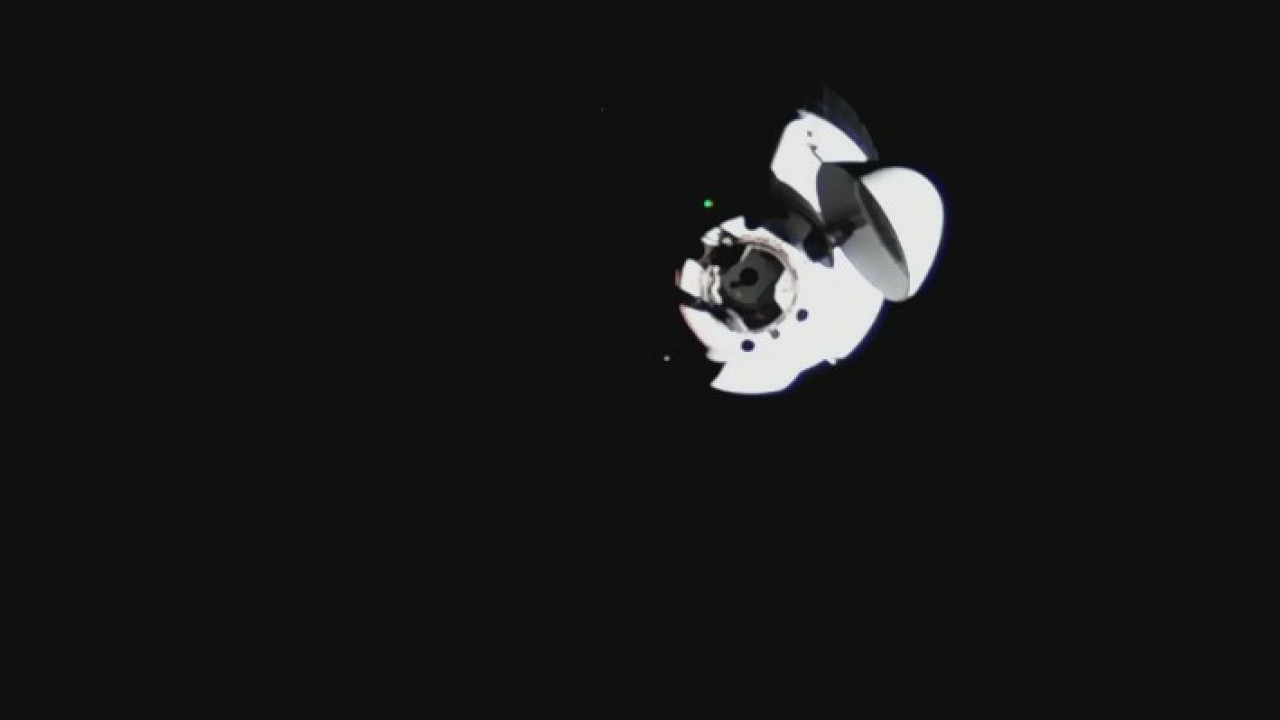 Cargo Dragon capsule docks at the International Space Station