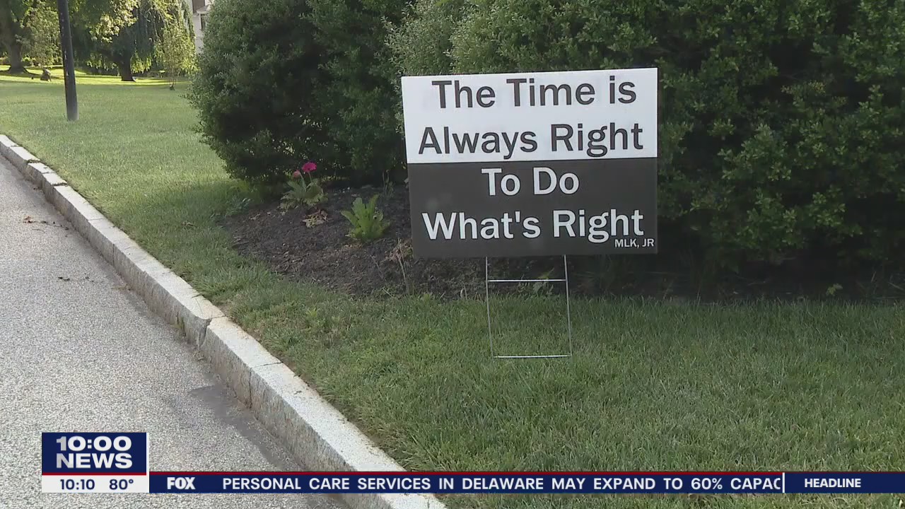 Mother and daughters creates signs to raise awareness about social injustice