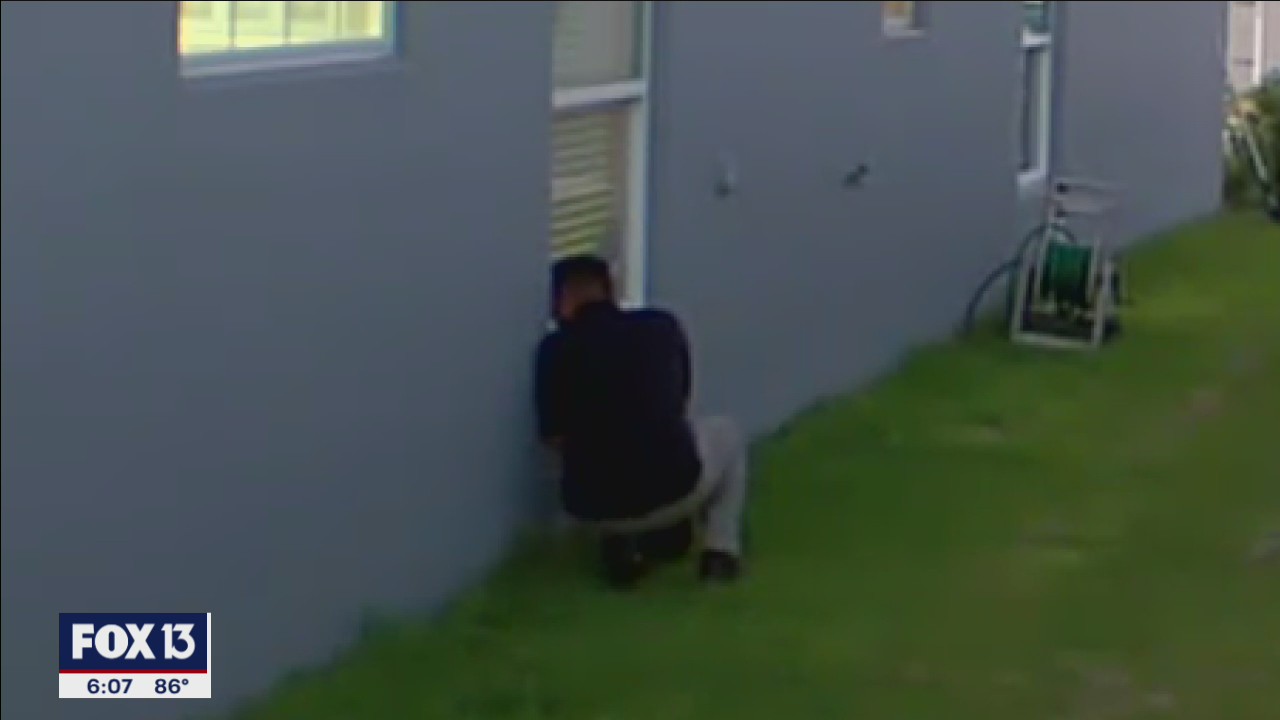 Surveillance camera catches alleged peeping Tom