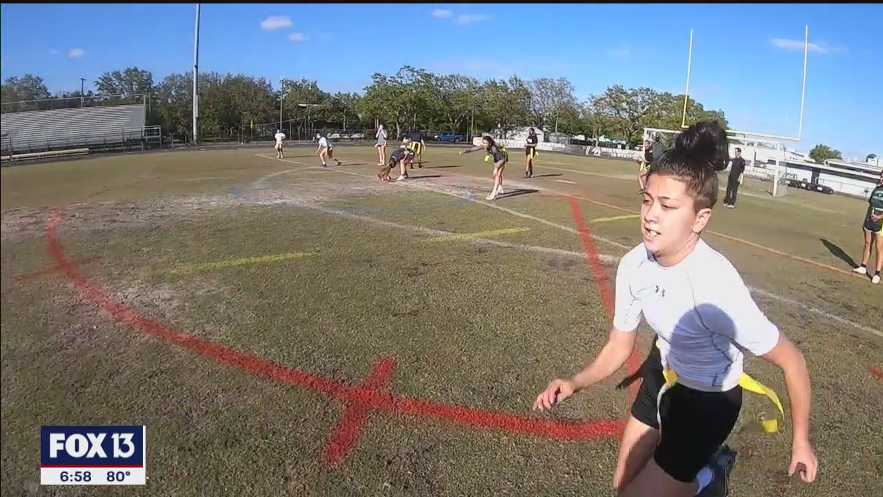 Girls' flag football team tackling cancer
