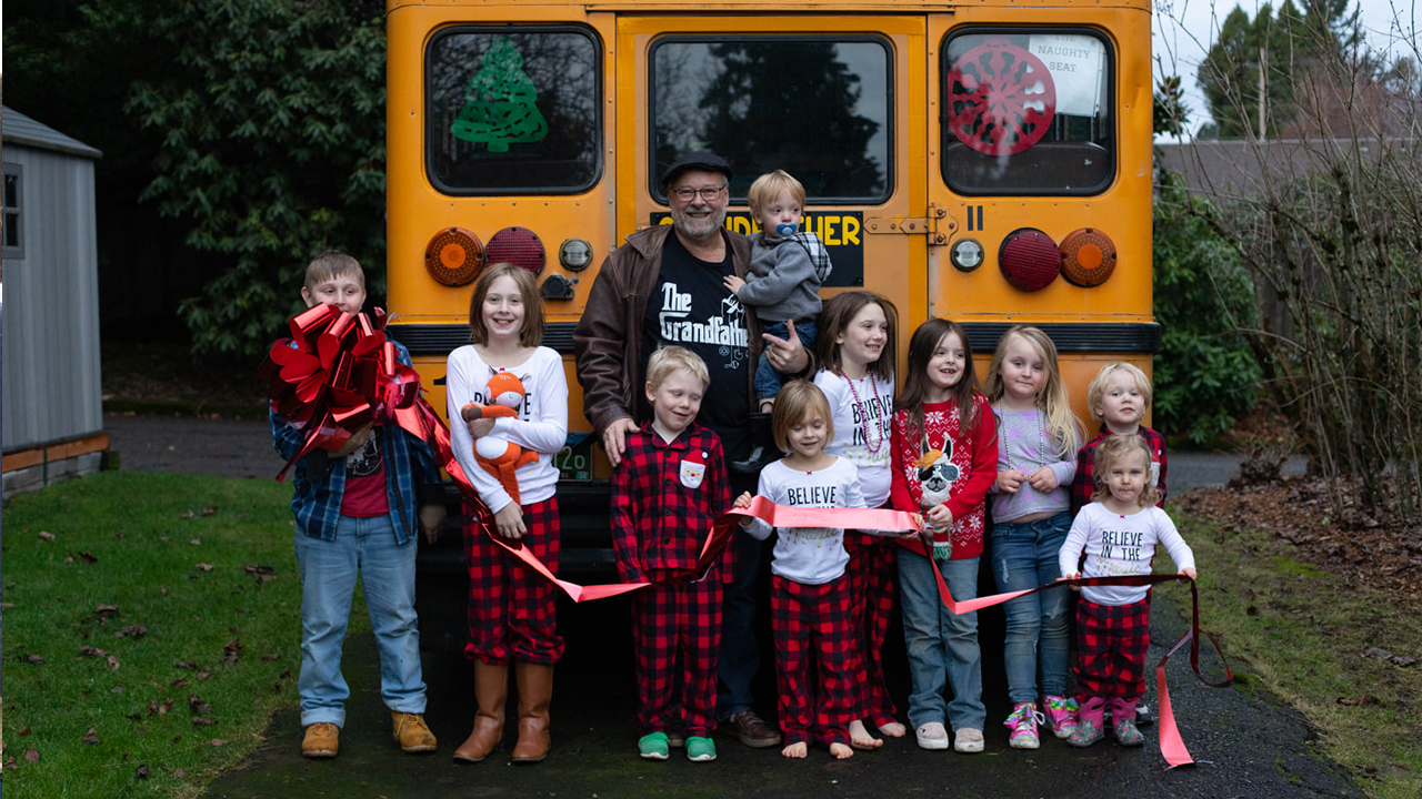 Grandfather of 10 surprises family with school bus to drive grandchildren to school each day