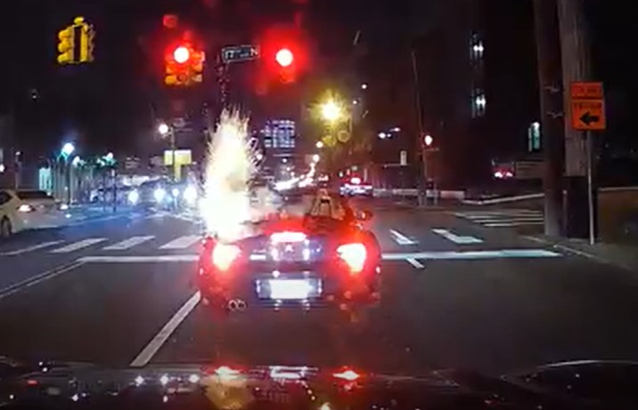 Driver burned after lit firework tossed into convertible