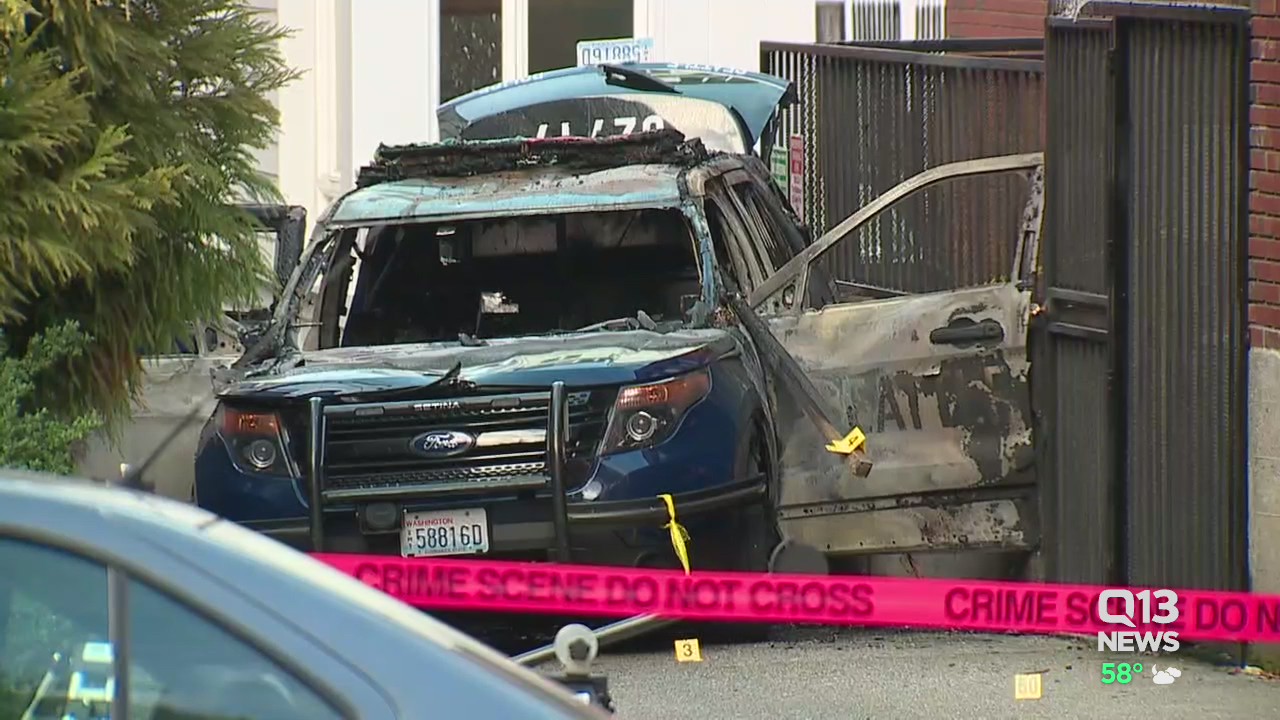 Man arrested after Seattle Police car set on fire with officer inside