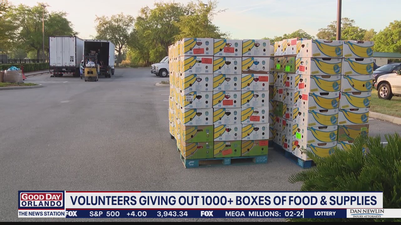 Volunteers delivering hundreds of boxes of food to families in need