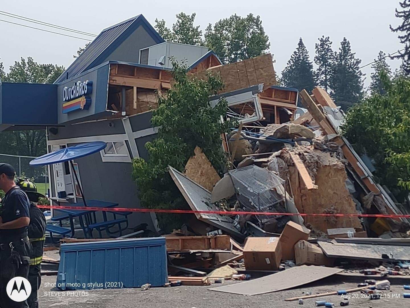 Dump truck plows into cars, buildings