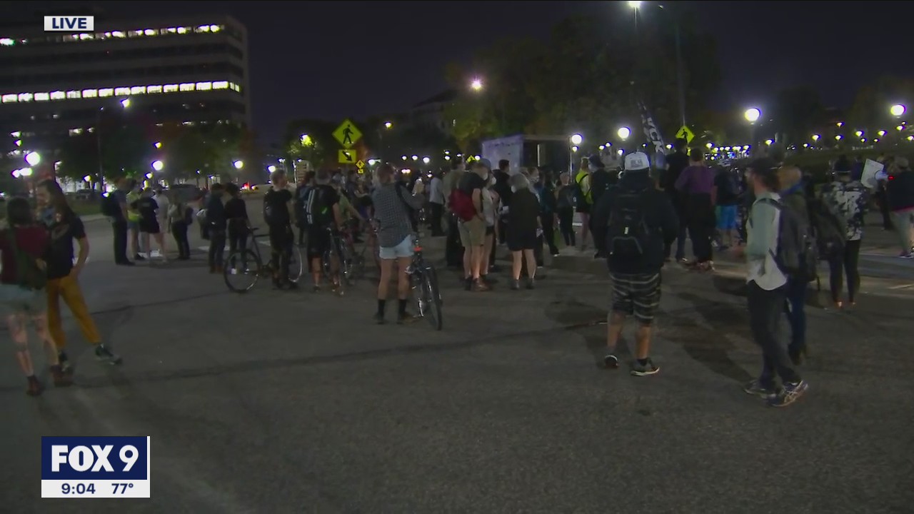 Protesters march in St. Paul on I-94 following charging decision in Taylor case