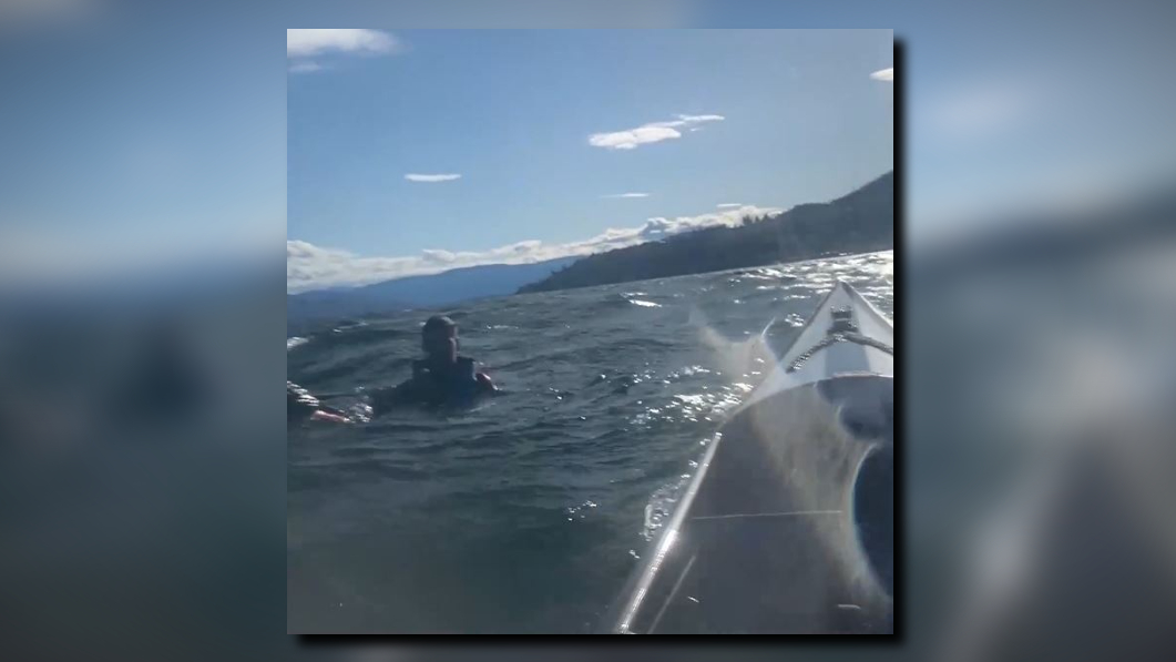 Video shows kayaker rescue stranded man on Canadian lake