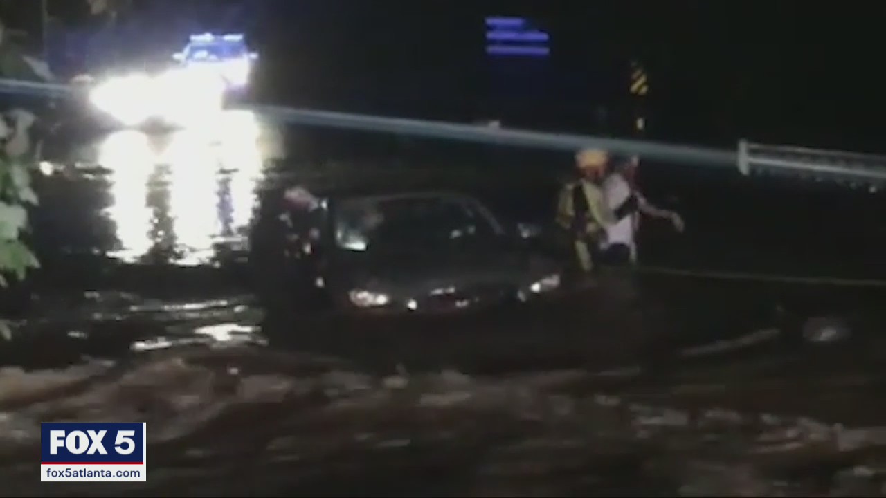 Firefighters rescue passengers stuck in water