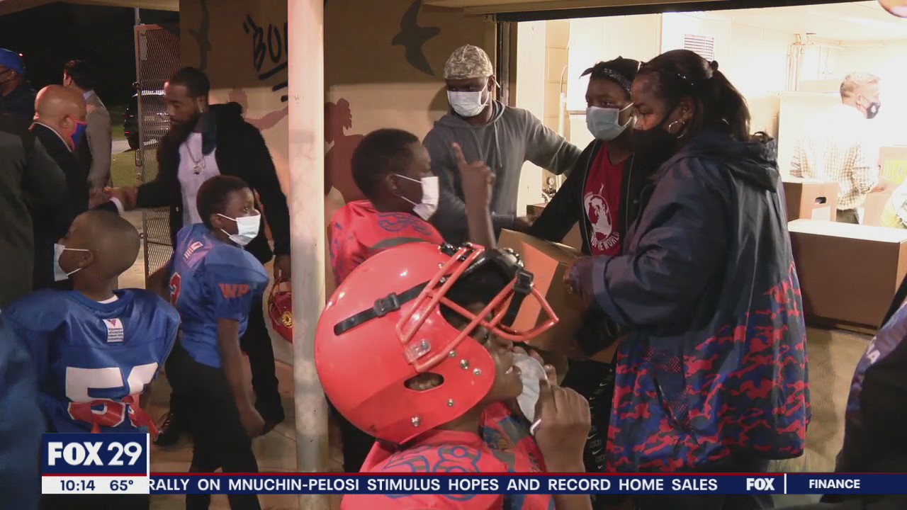 Camden youth football program donates food to families of players in the community