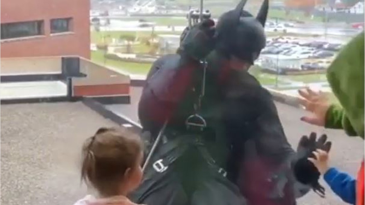 SWAT team member dressed as Batman surprises patients at children’s hospital