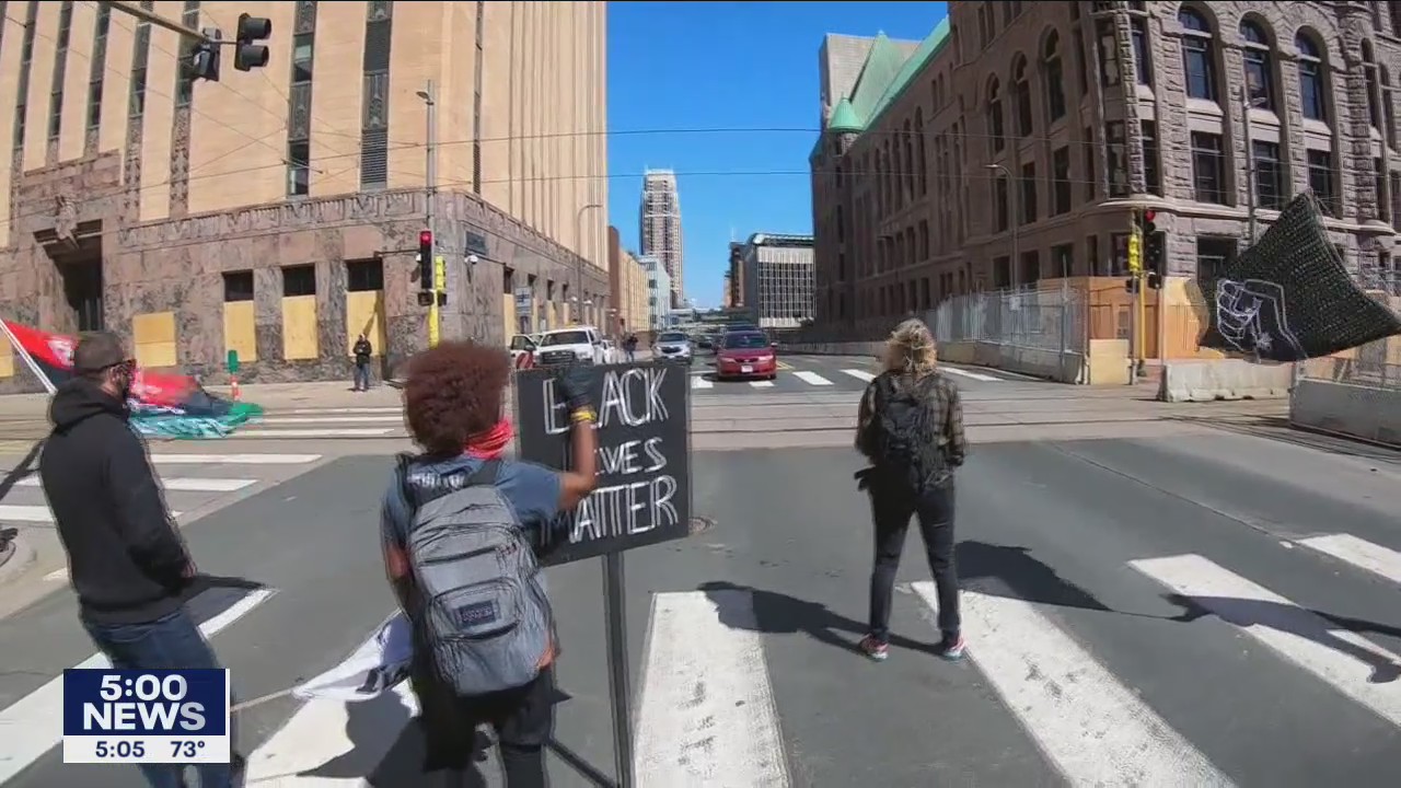 Demonstrators rally during day one of the Derek Chauvin trial