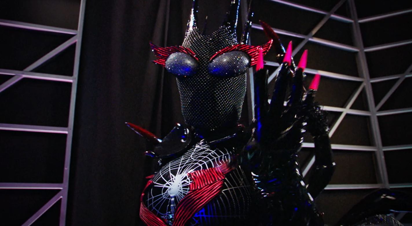 The black widow on Season 2 of ‘The Masked Singer’ will leave the competition hanging by a thread