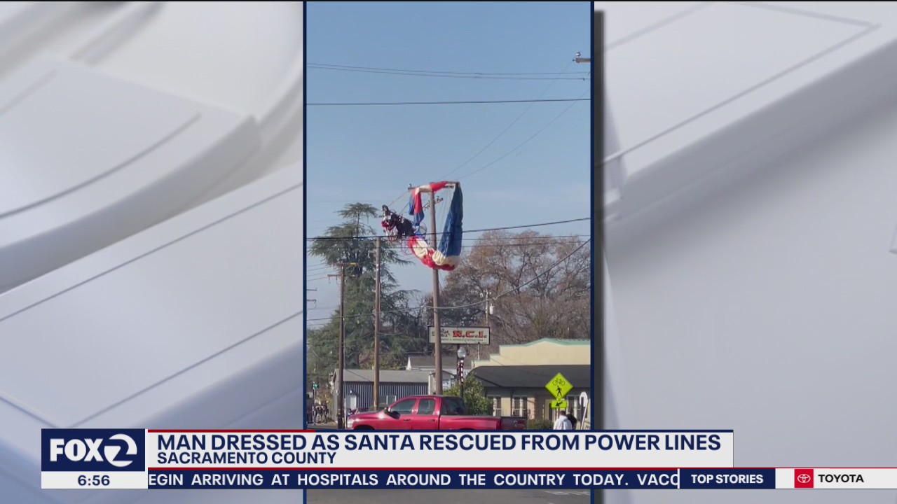 Paraglider dressed as Santa winds up in power lines
