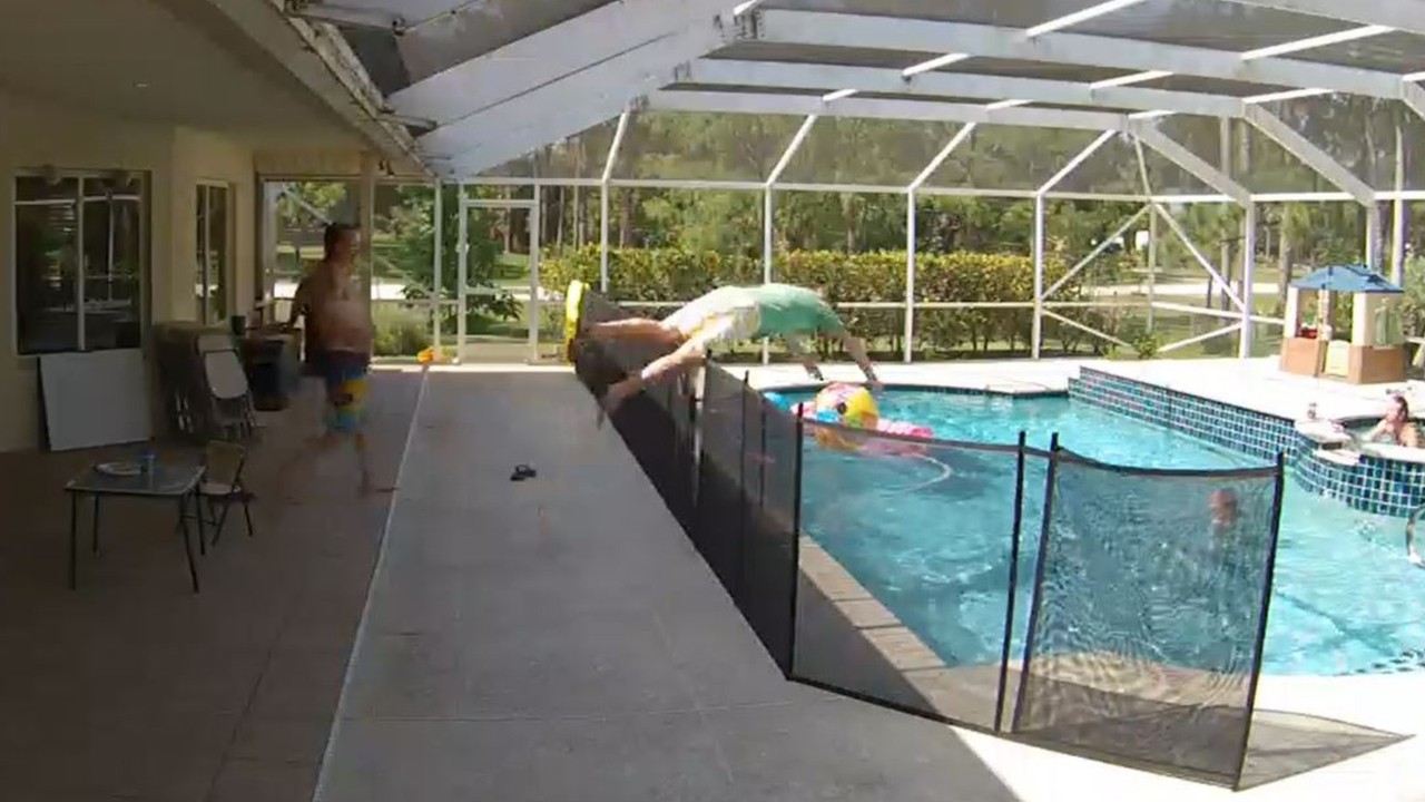 Hero dad leaps over pool fence, dives head-first to rescue toddler son from drowning