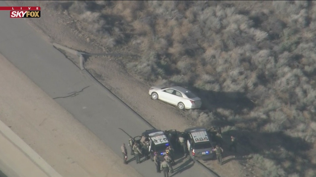 Wanted murder suspect in standoff with officers