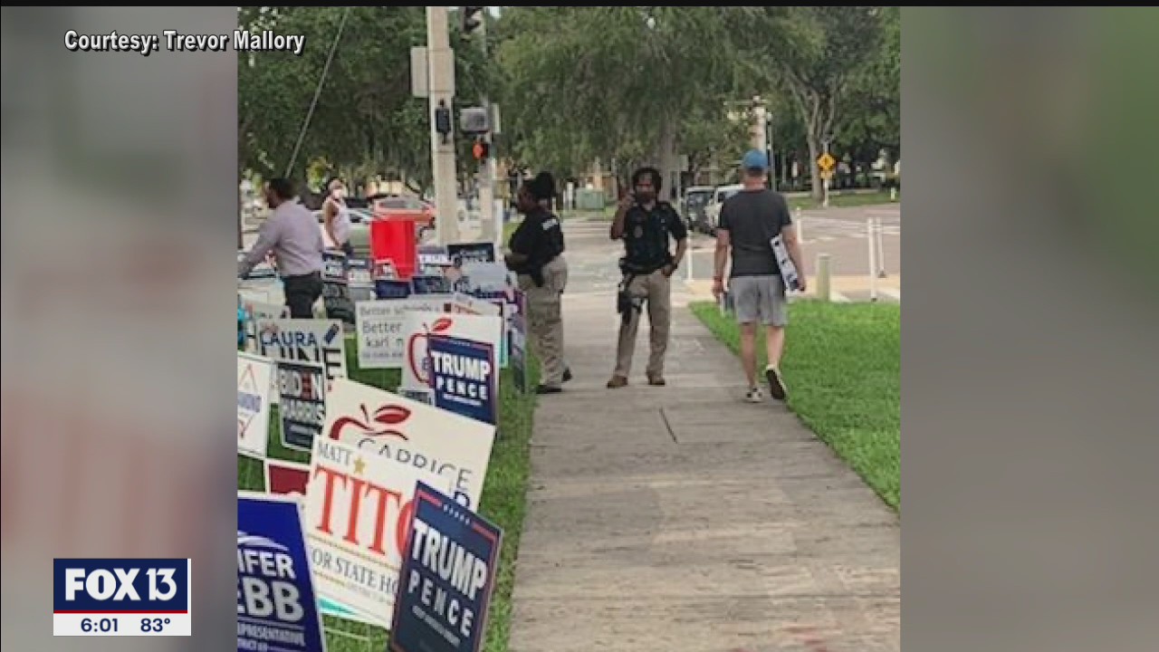 Armed security guard near early voting site