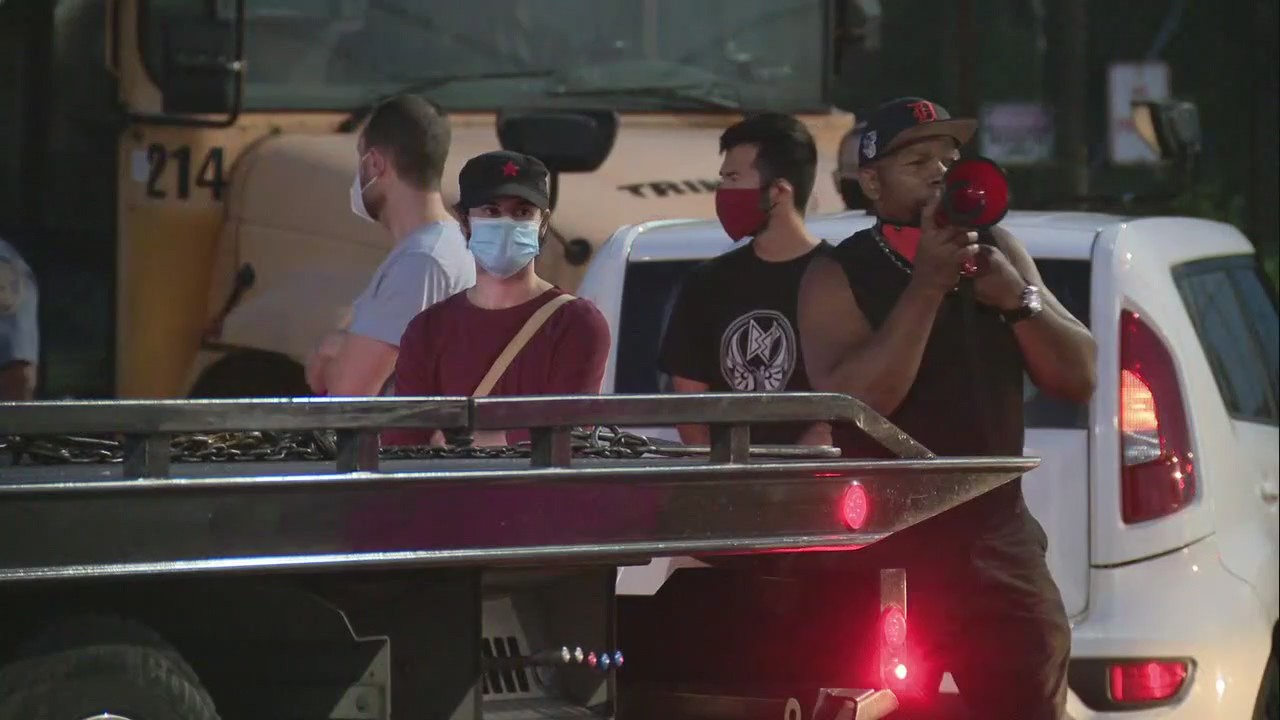 Vehicle nearly collides with school bus exiting lot as protests against Detroit schools continue