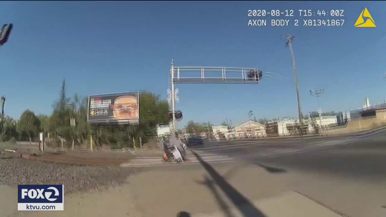 Officer who rescued man in wheelchair from being struck by train speaks