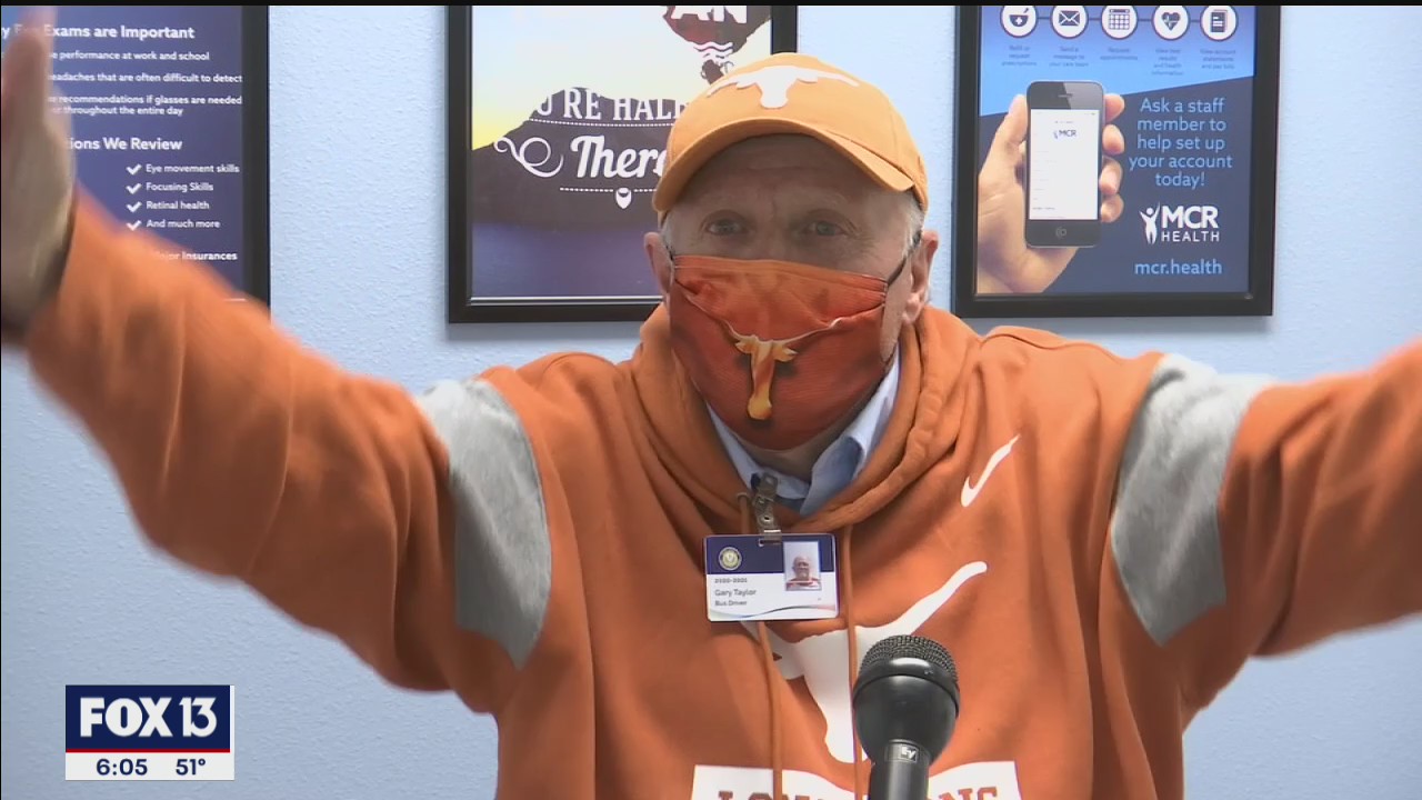 Elated school employee gets first vaccine dose
