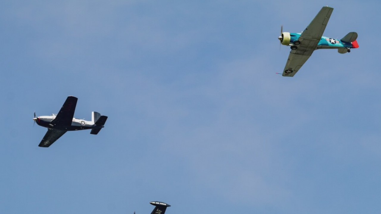 Commemorative Air Force Group doing flyovers over neighborhoods