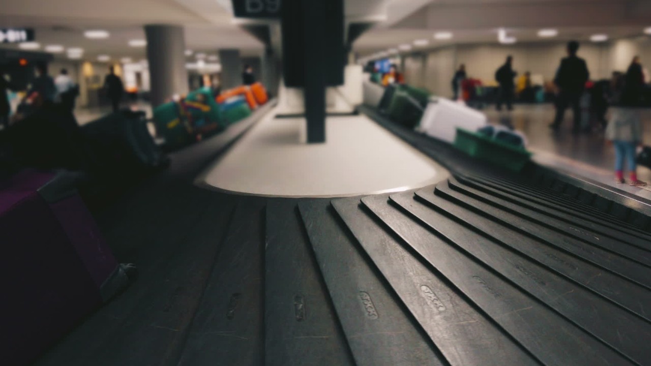 Woman claims airline employee defaced rainbow luggage tag