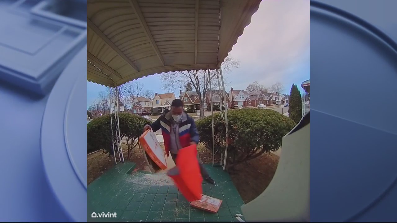DoorDash driver caught on camera dropping pizza on ground, putting it back in box