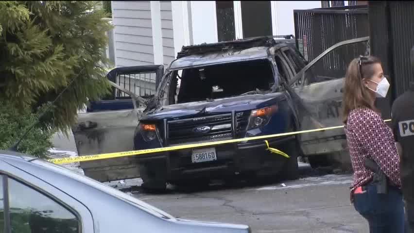 Seattle police arrest suspect after cop car set on fire