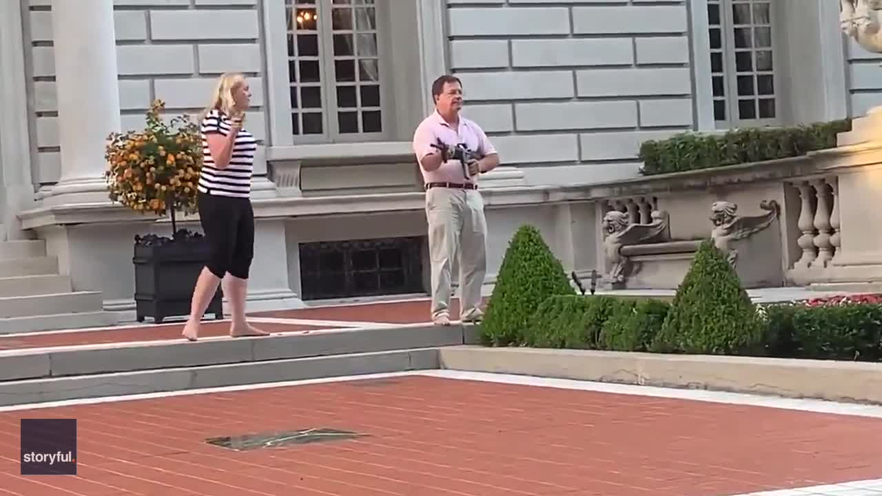 Video shows couple drawing guns at protesters heading to St. Louis mayor's home