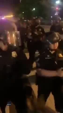 Video shows Washington police officer dragged to his feet by colleagues after kneeling with protesters