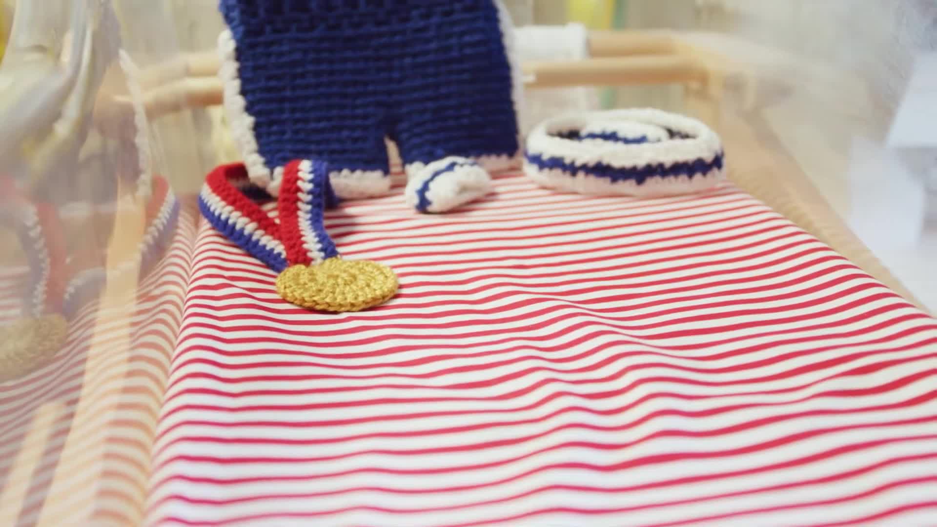Kansas City Nurses Crochet Mini Olympic Outfits for Newborns