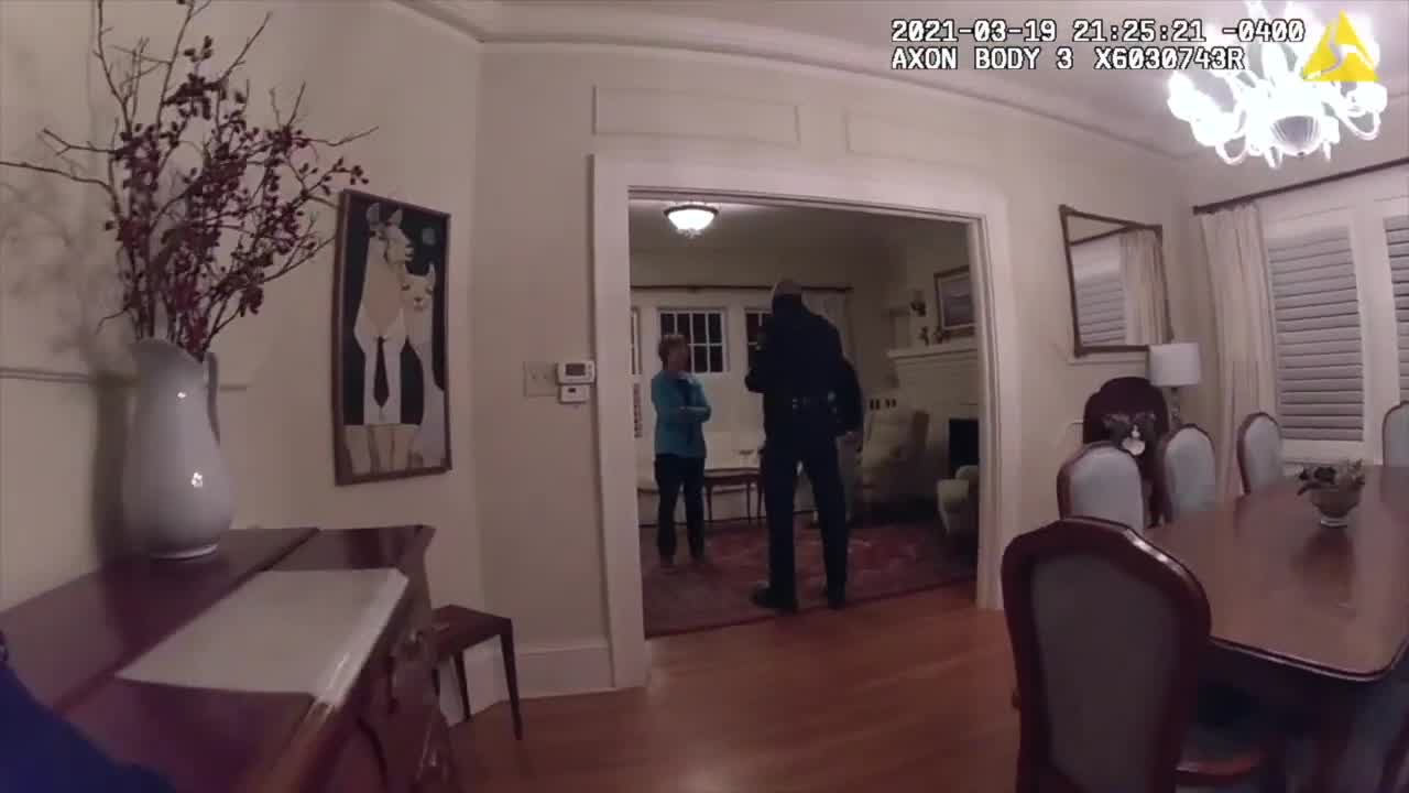 Police officers entice coyote out of kitchen with dog toys